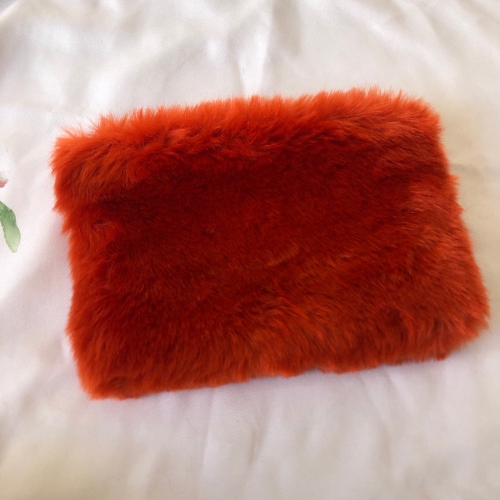 Urban Outfitters Coral Furry Clutch